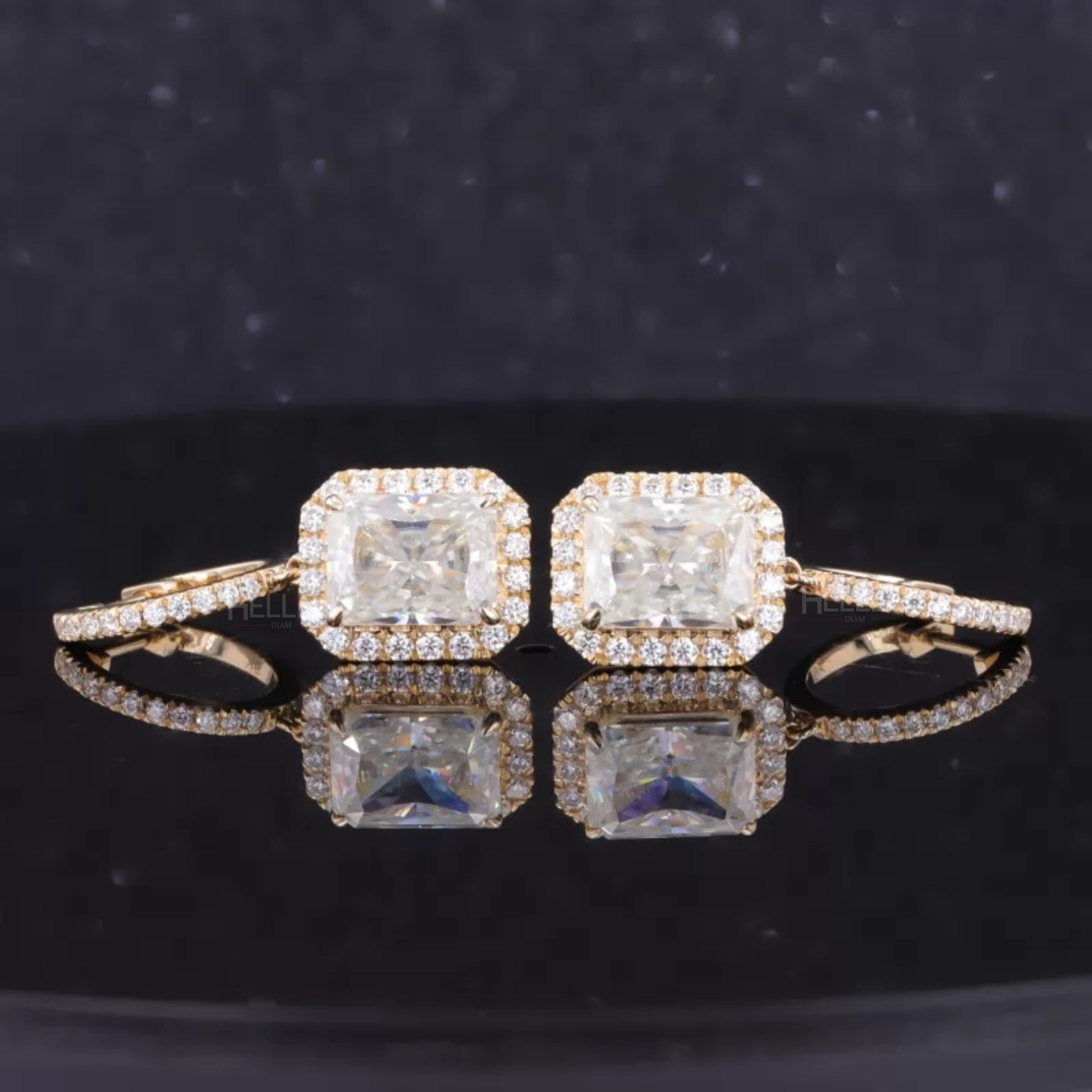 Sterling silver halo drop earrings with radiant cut moissanite centerpiece