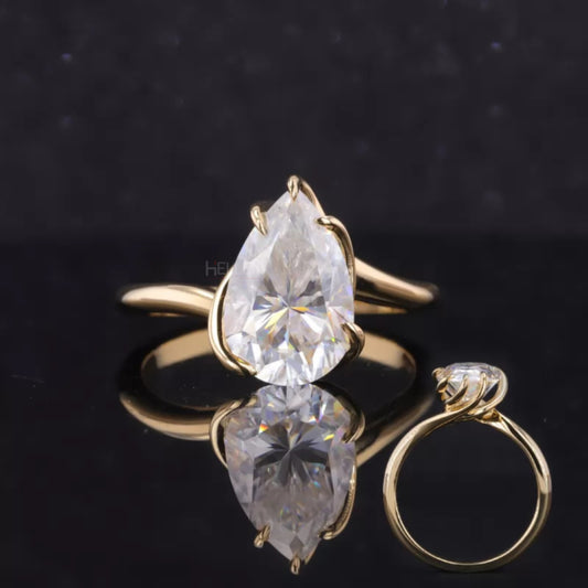 Unique spiral setting pear cut moissanite solitaire proposal ring with 5 prongs – bold and modern engagement design

