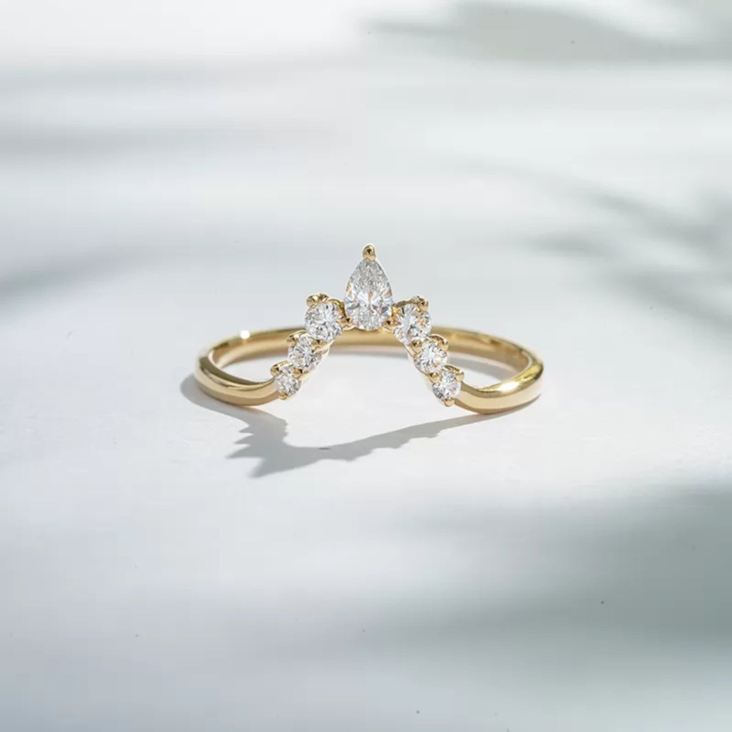 Vintage-style V-shaped band with round and pear moissanite – graceful sparkle with classic design

