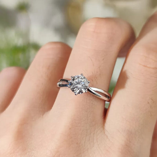 Classic solitaire round cut moissanite engagement ring with split shank and 6 prong iconic setting – timeless bridal jewelry