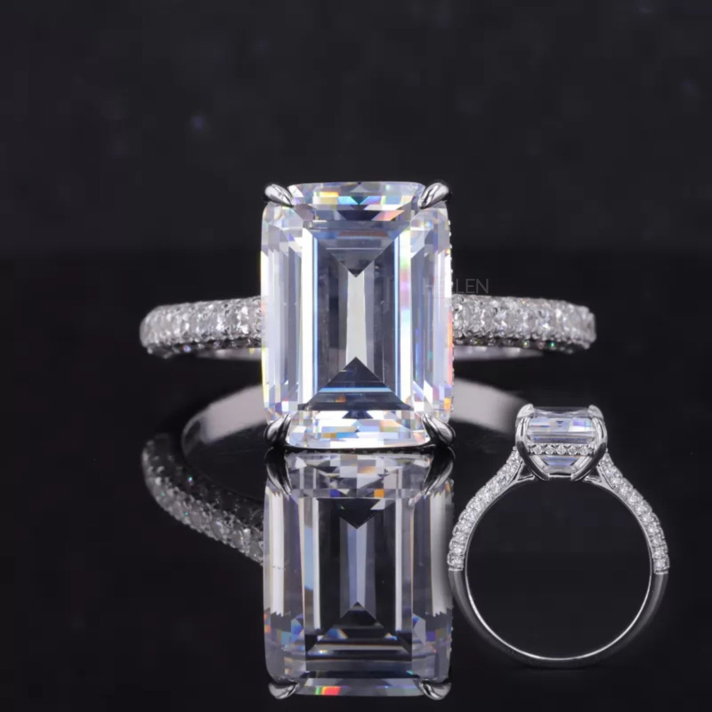 Emerald cut moissanite solitaire ring with hidden halo and round side stones – elegant vintage-inspired design
