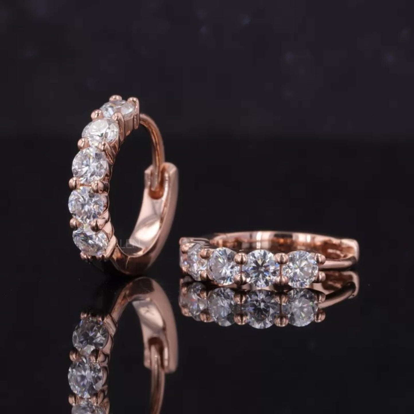 Elegant sterling silver huggie hoop earrings with sparkling moissanite