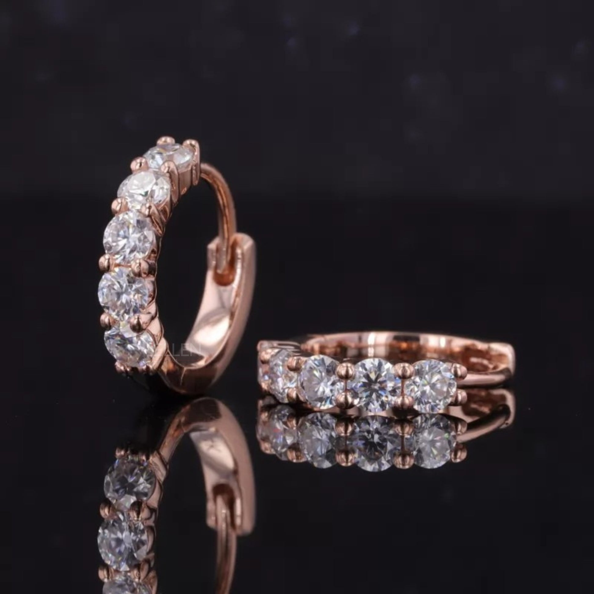 Elegant sterling silver huggie hoop earrings with sparkling moissanite