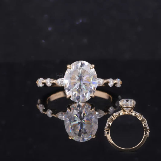 Oval moissanite solitaire ring with a band of marquise and round stones – sparkling and elegant statement piece