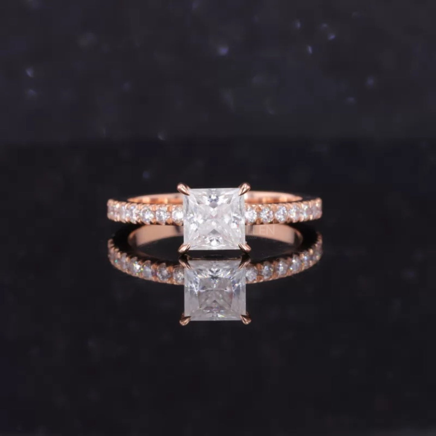 Princess cut moissanite solitaire ring with round diamond-accented shank – regal and refined engagement style

