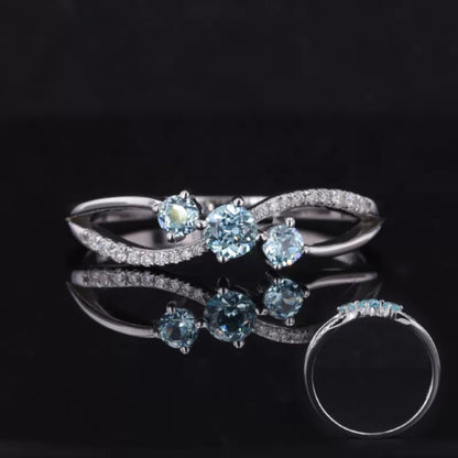 Aquamarine and moissanite three-stone ring with round cuts – fresh and serene bridal or promise ring