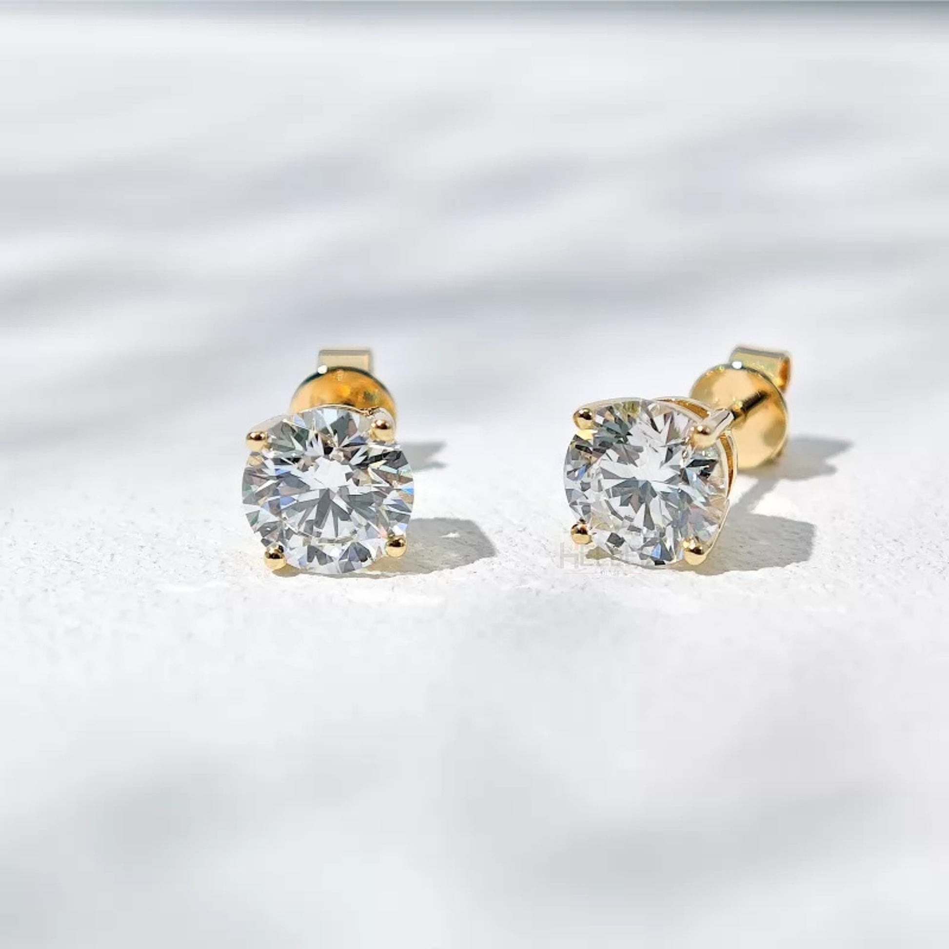 Brilliant round cut moissanite solitaire studs in sterling silver – timeless sparkle for all occasions