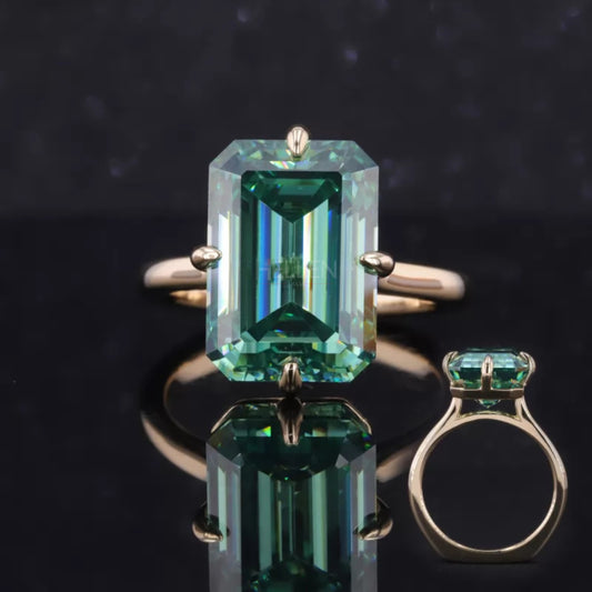 Emerald cut solitaire moissanite engagement ring with green gemstone hue – bold and regal bridal style