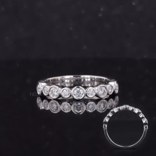 Sterling silver anniversary band with round cut moissanite in bezel setting – sleek and secure brilliance

