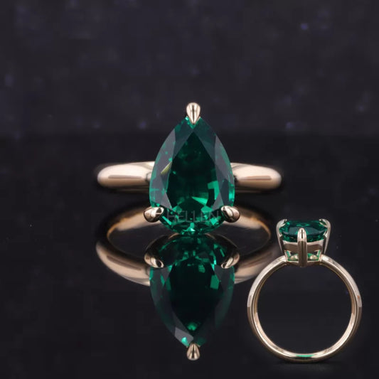 Pear cut green emerald gemstone solitaire engagement ring – vibrant and elegant semi-precious bridal jewelry