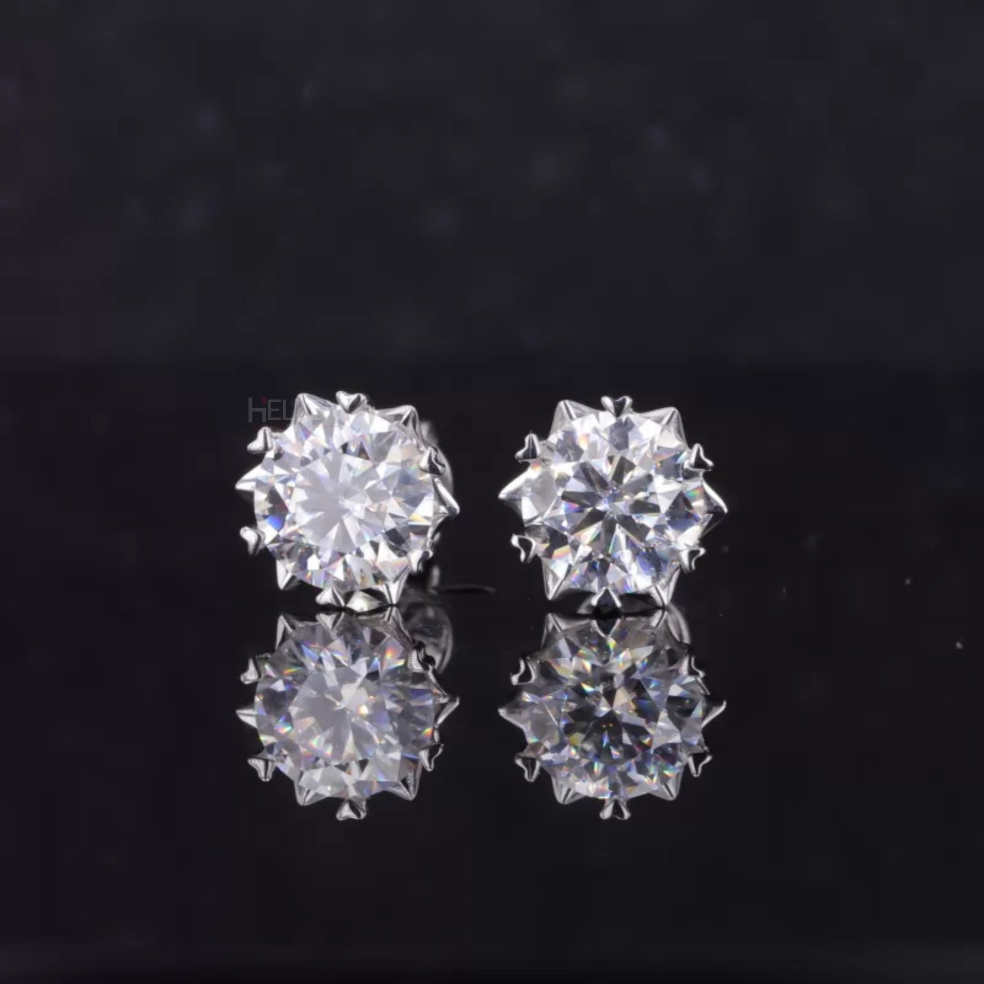 Round cut moissanite studs with heart-shaped prongs – romantic detail in modern minimalist studs