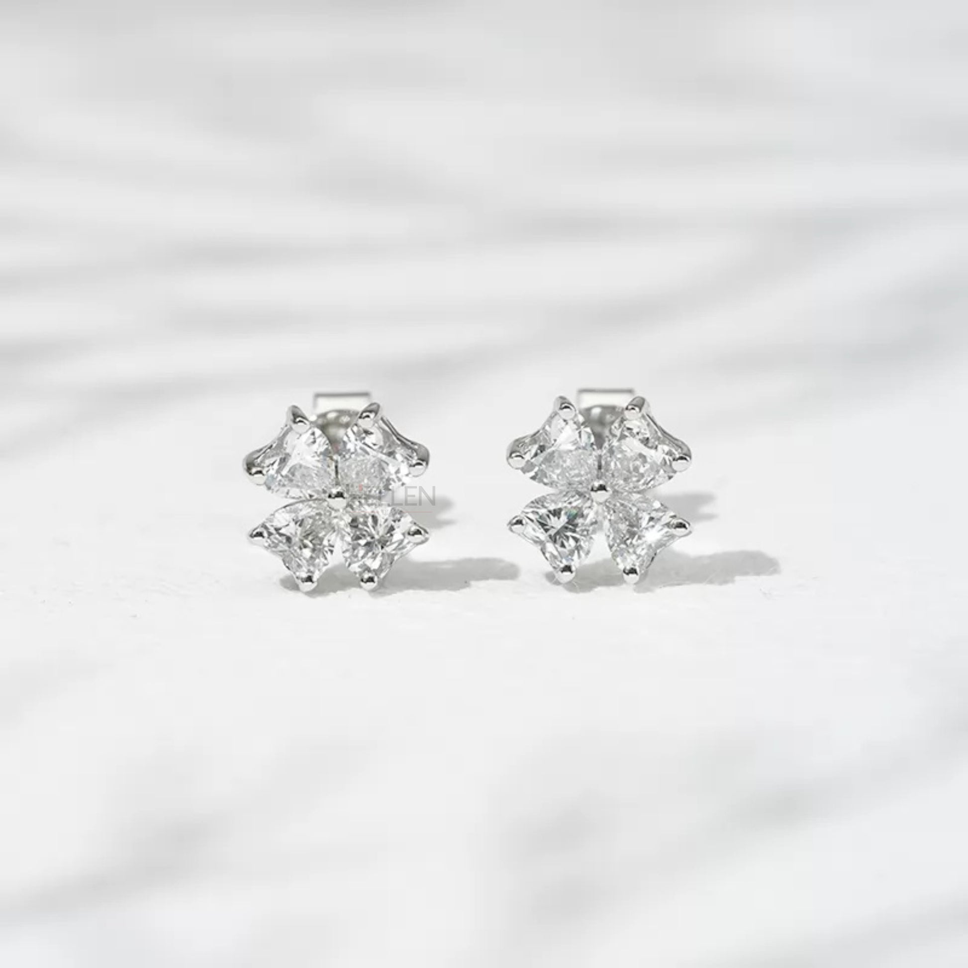 Heart cut moissanite floral design studs in 925 silver – elegant blend of romance and natural motifs