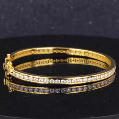 Gold-plated moissanite bracelet with iconic band and channel setting – classic and radiant jewelry piece

