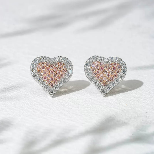 Heart shaped studs with pink gemstone and moissanite – playful and romantic two-tone design

