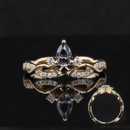 V-curved wedding band with round and salt and pepper pear cut moissanite – edgy and modern pairing band