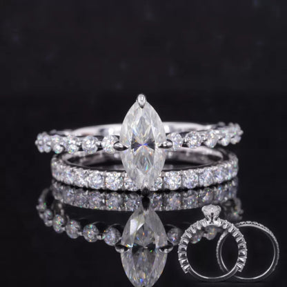 Marquise cut solitaire ring with half-round eternity band – timeless shape paired with sparkling simplicity

