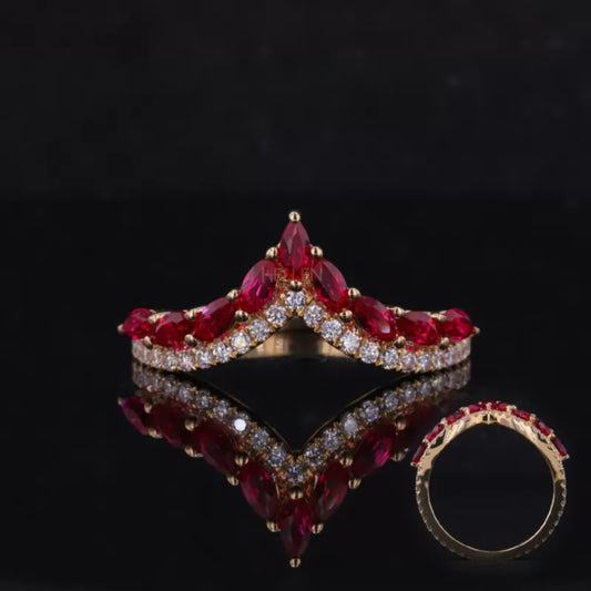 V-shaped ring with vibrant ruby gemstone and sparkling moissanite