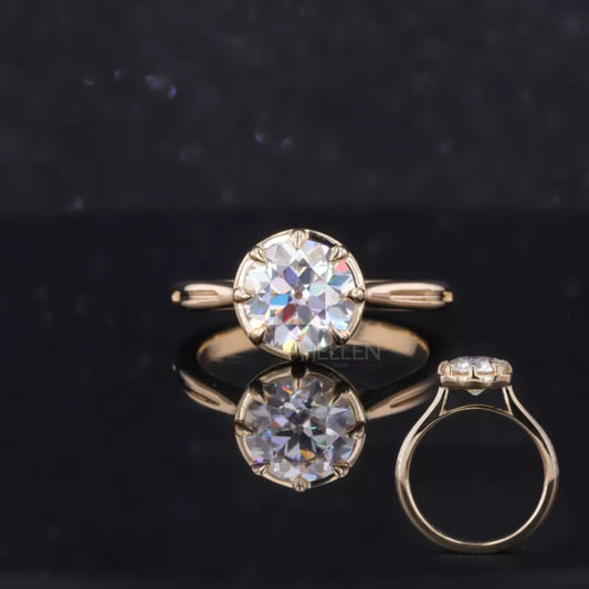 Vintage-style old European cut moissanite proposal ring with bold tiger prongs – unique and dramatic bridal ring