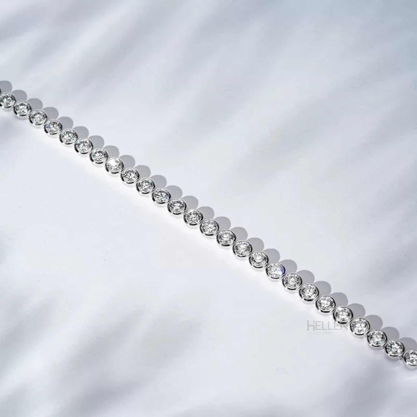 Round cut moissanite tennis bracelet with bezel setting – secure and sleek must-have jewelry piece