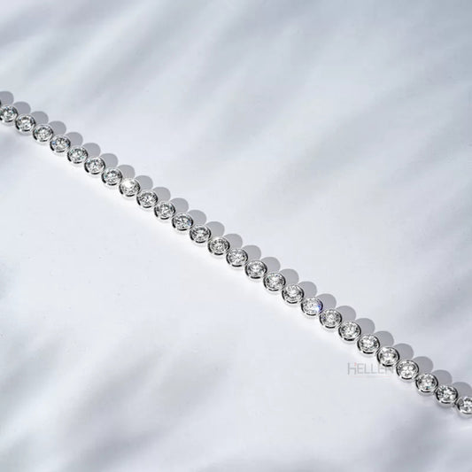 Round cut moissanite tennis bracelet with bezel setting – secure and sleek must-have jewelry piece