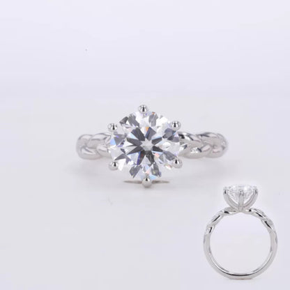Round cut moissanite solitaire engagement ring with twisted shank – elegant blend of tradition and modern flair

