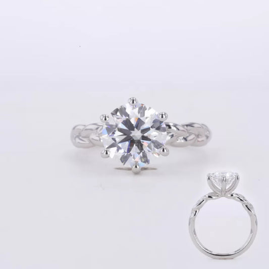 Round cut moissanite solitaire engagement ring with twisted shank – elegant blend of tradition and modern flair

