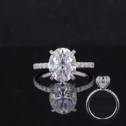 Oval cut moissanite solitaire ring with diamond accents on tiger prongs – bold and secure luxury engagement design

