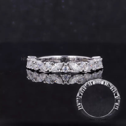 Wedding band with marquise and round moissanite stones – graceful combination of curves and brilliance


