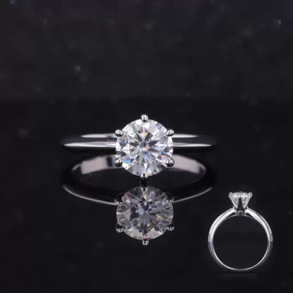 Classic round cut moissanite engagement ring with regal crown setting – timeless solitaire style for bridal occasions