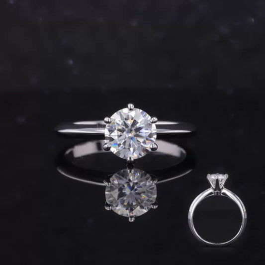 Classic round cut moissanite engagement ring with regal crown setting – timeless solitaire style for bridal occasions