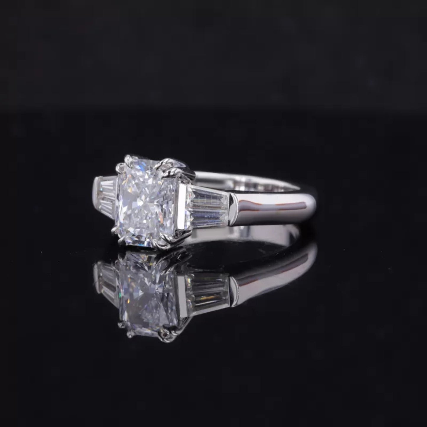 Emerald and Tapered Baguette 3 Stone Ring