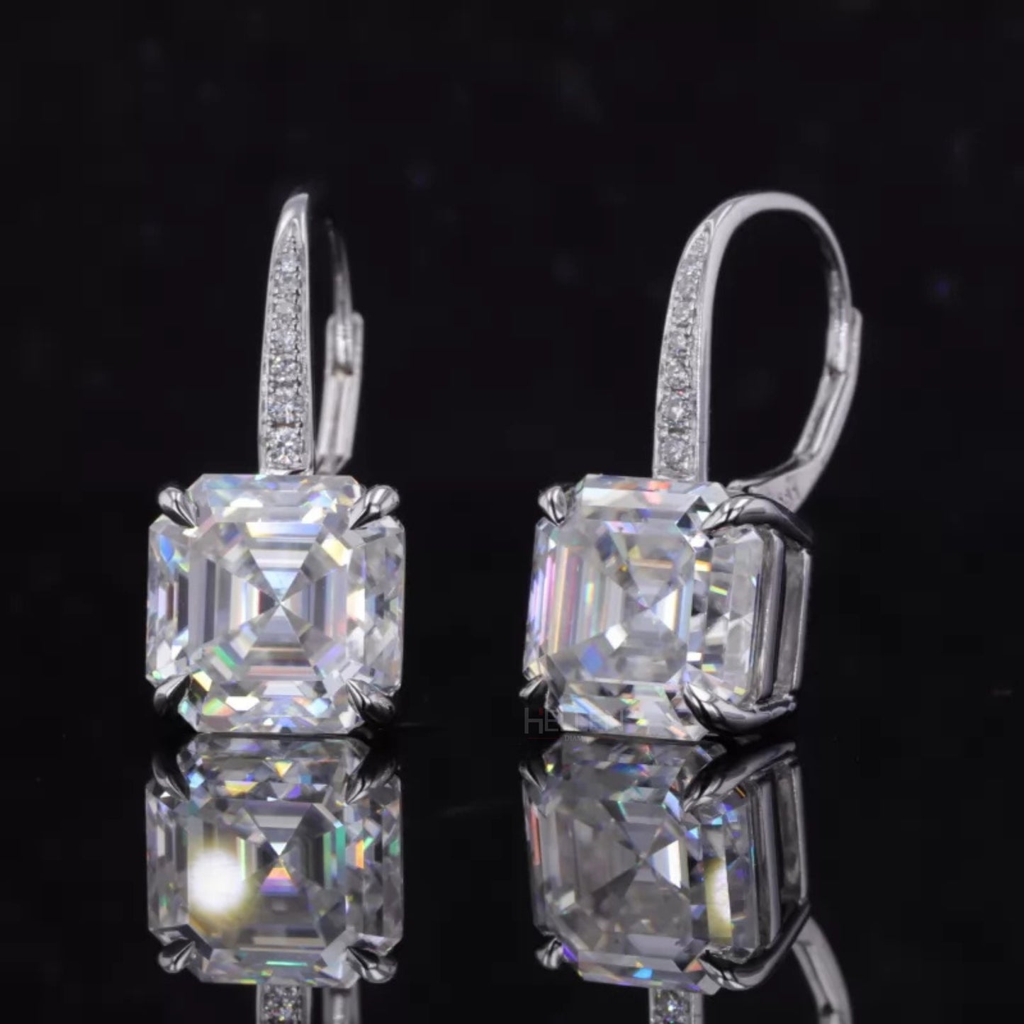 Sterling silver hoop earrings with moissanite and eagle claw prong setting