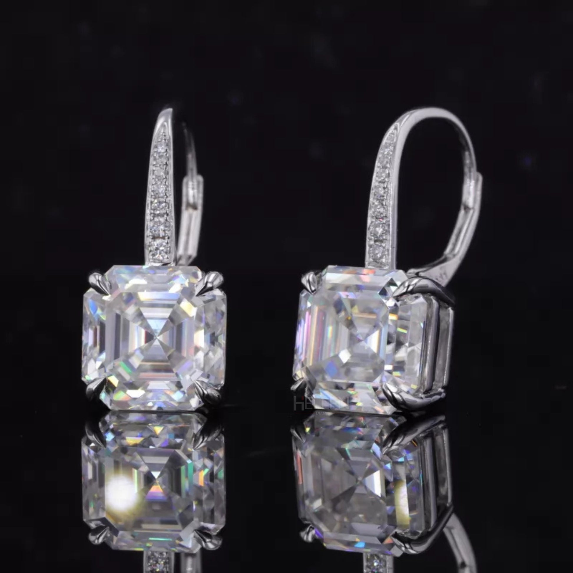 Sterling silver hoop earrings with moissanite and eagle claw prong setting