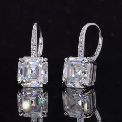 Sterling silver hoop earrings with moissanite and eagle claw prong setting