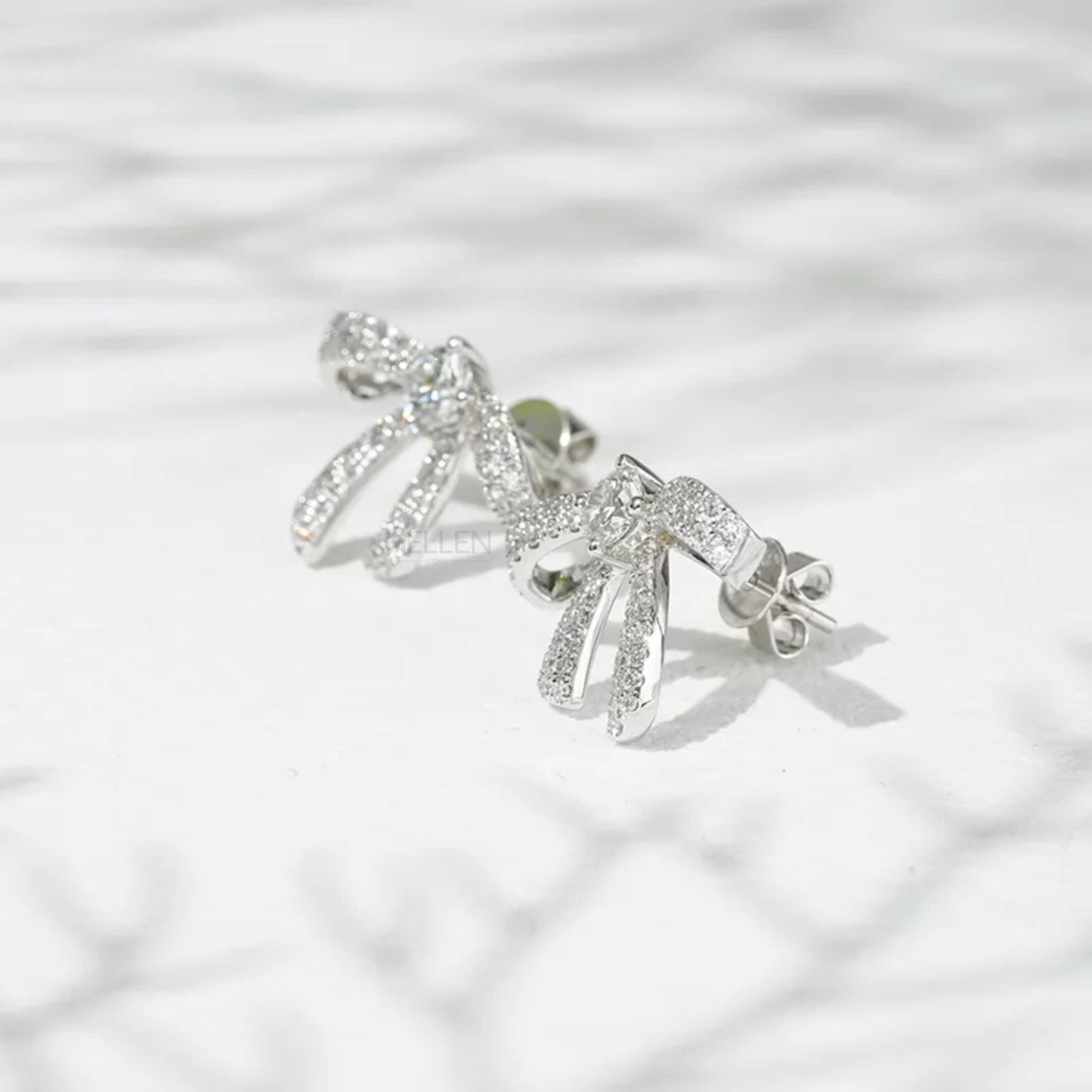 Elegance Silver Moissanite Ribbon Bow Stud Earrings