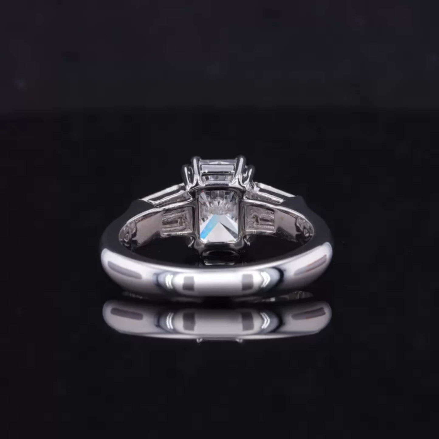 Emerald and Tapered Baguette 3 Stone Ring