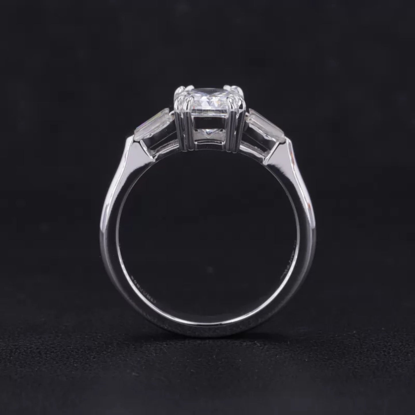 Emerald and Tapered Baguette 3 Stone Ring