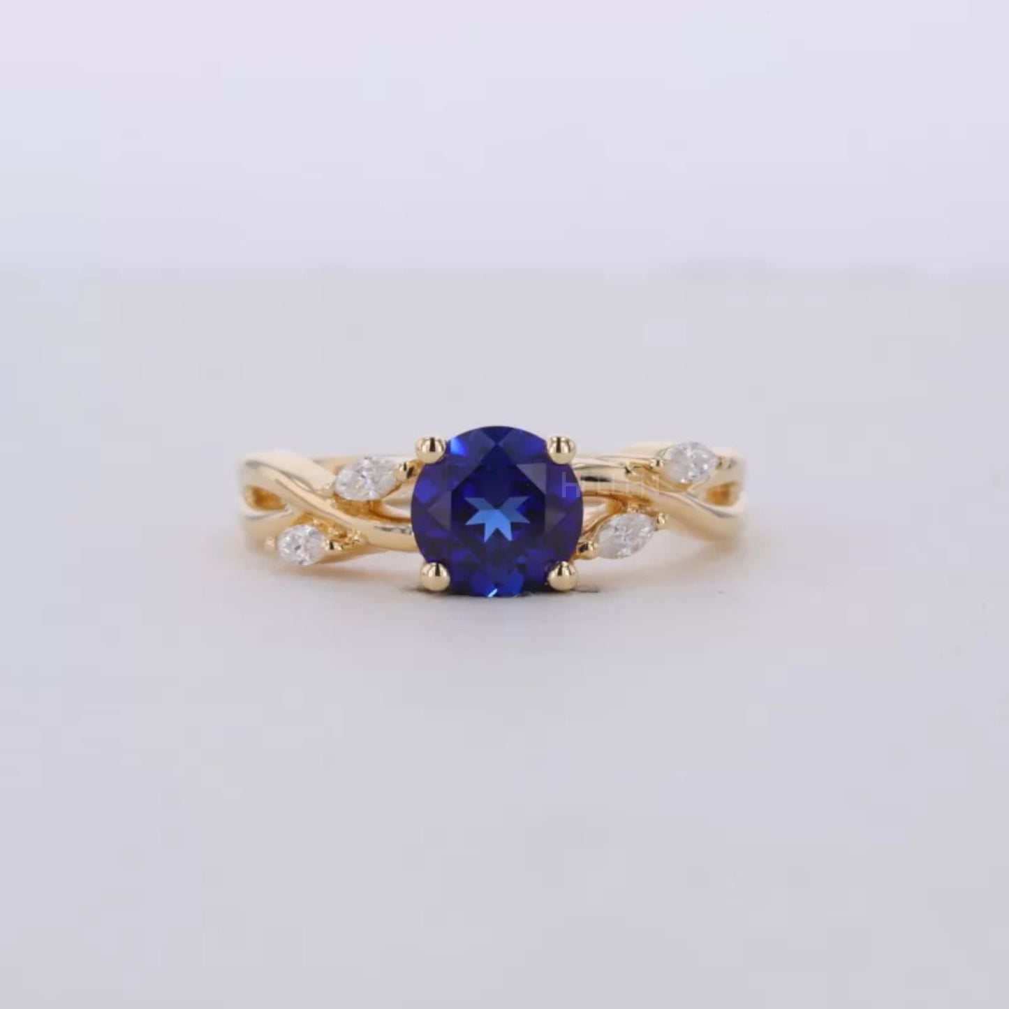 Blue Sapphire Round Cut Gemstone & Marquise Side Stone Ring