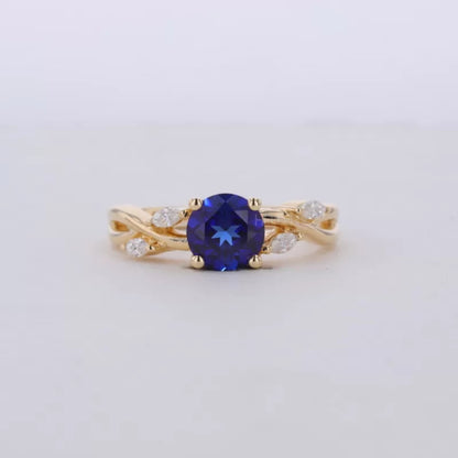 Blue Sapphire Round Cut Gemstone & Marquise Side Stone Ring