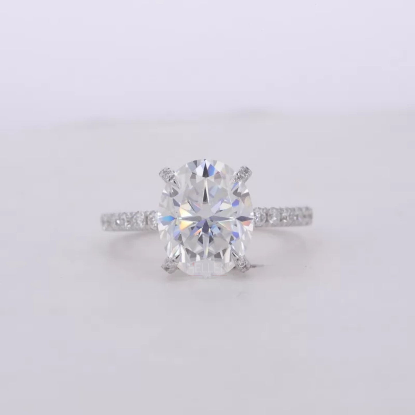 Oval Cut Moissanite Solitaire with Diamonds on Tiger Prongs Ring