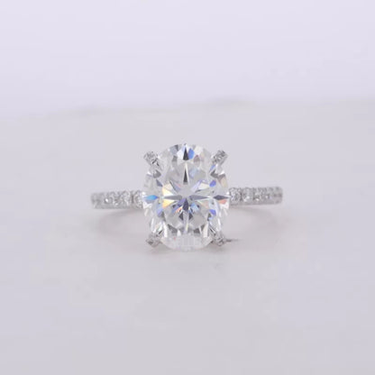 Oval Cut Moissanite Solitaire with Diamonds on Tiger Prongs Ring