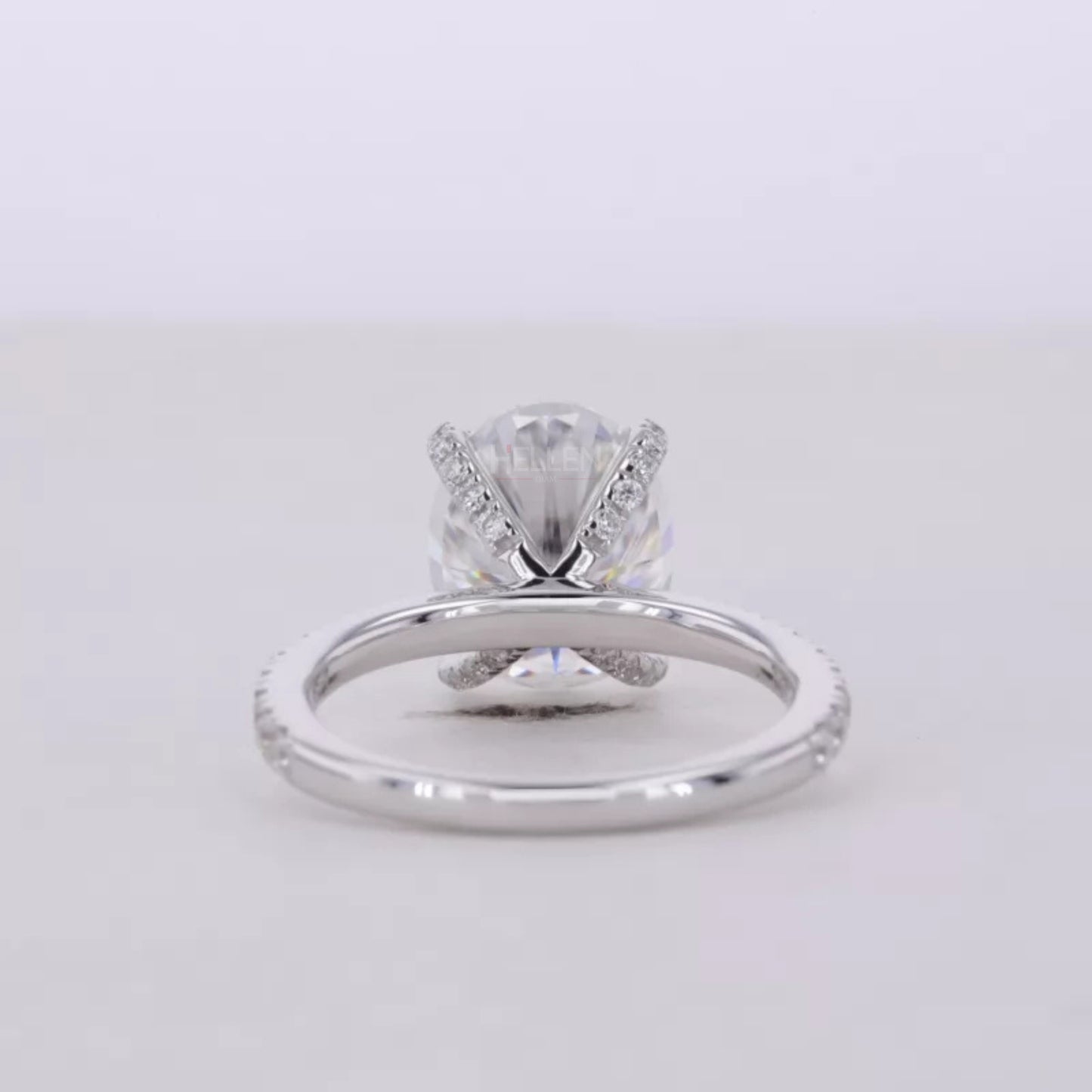 Oval Cut Moissanite Solitaire with Diamonds on Tiger Prongs Ring